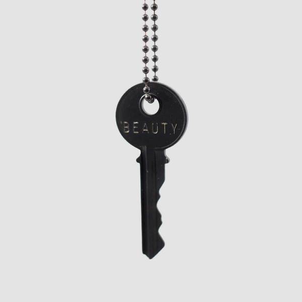 Beauty Key Necklace Black  The Classic Ball Chain Key Necklace has been a mainstay at The Giving Keys from day one. This piece can be paired with everyday trends to add the perfect amount of inspiration to your outfit. 