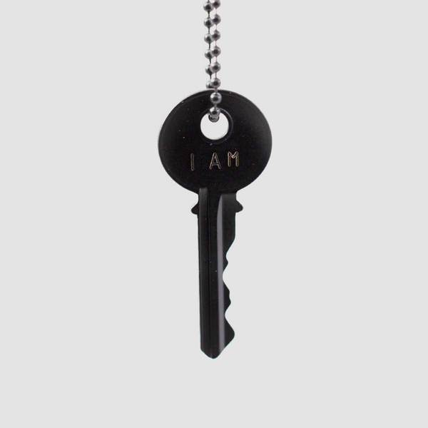 I Am Key Necklace Black  The Classic Ball Chain Key Necklace has been a mainstay at The Giving Keys from day one. This piece can be paired with everyday trends to add the perfect amount of inspiration to your outfit. 